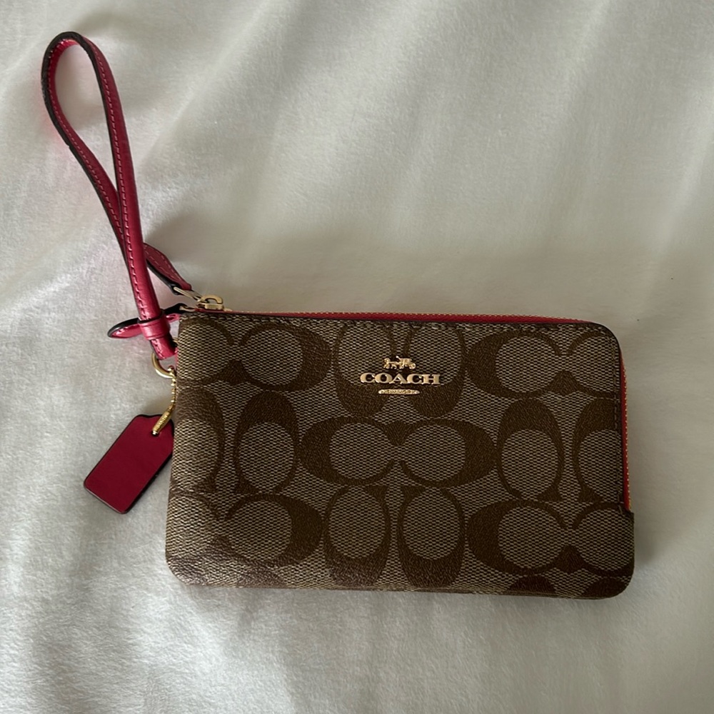 Brown and pink coach, double flap wristlet.